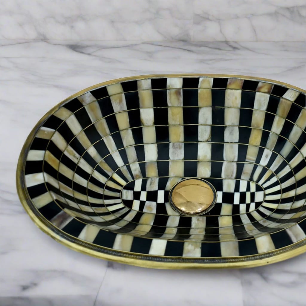 Side view of the Moroccan brass bathroom sink highlighting the depth and curved design of the basin