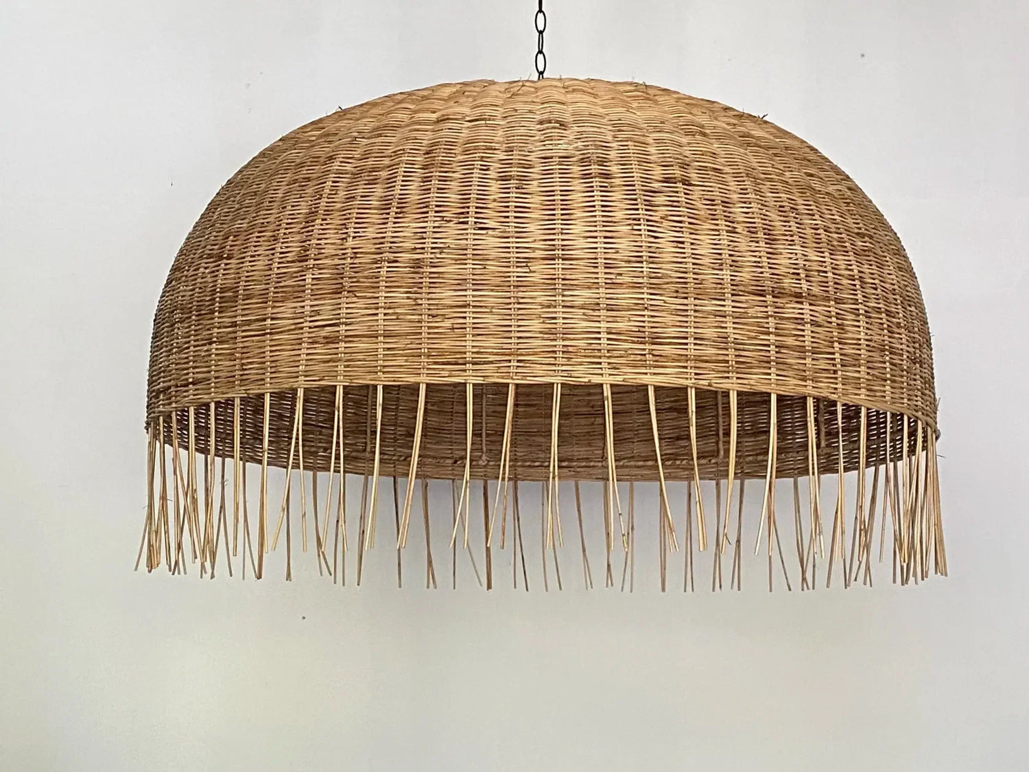 Frayed Extra Large Rattan Dome Wicker Pendant Light hangs with Chain