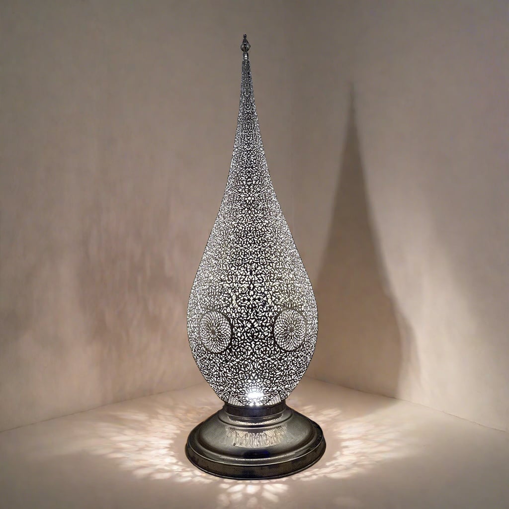 Single Moroccan brass floor lamp in silver finish, displaying fine hand-pierced patterns and the unique light and shadow effect