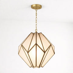 Geometric pendant light with frosted glass panels and a gold brass frame, suspended from a white ceiling by a matching chain